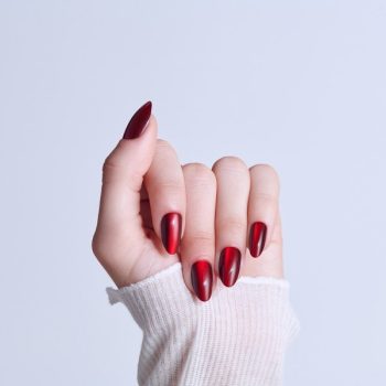 KISS Core press-on nails in Apple Blossom red, medium almond shape